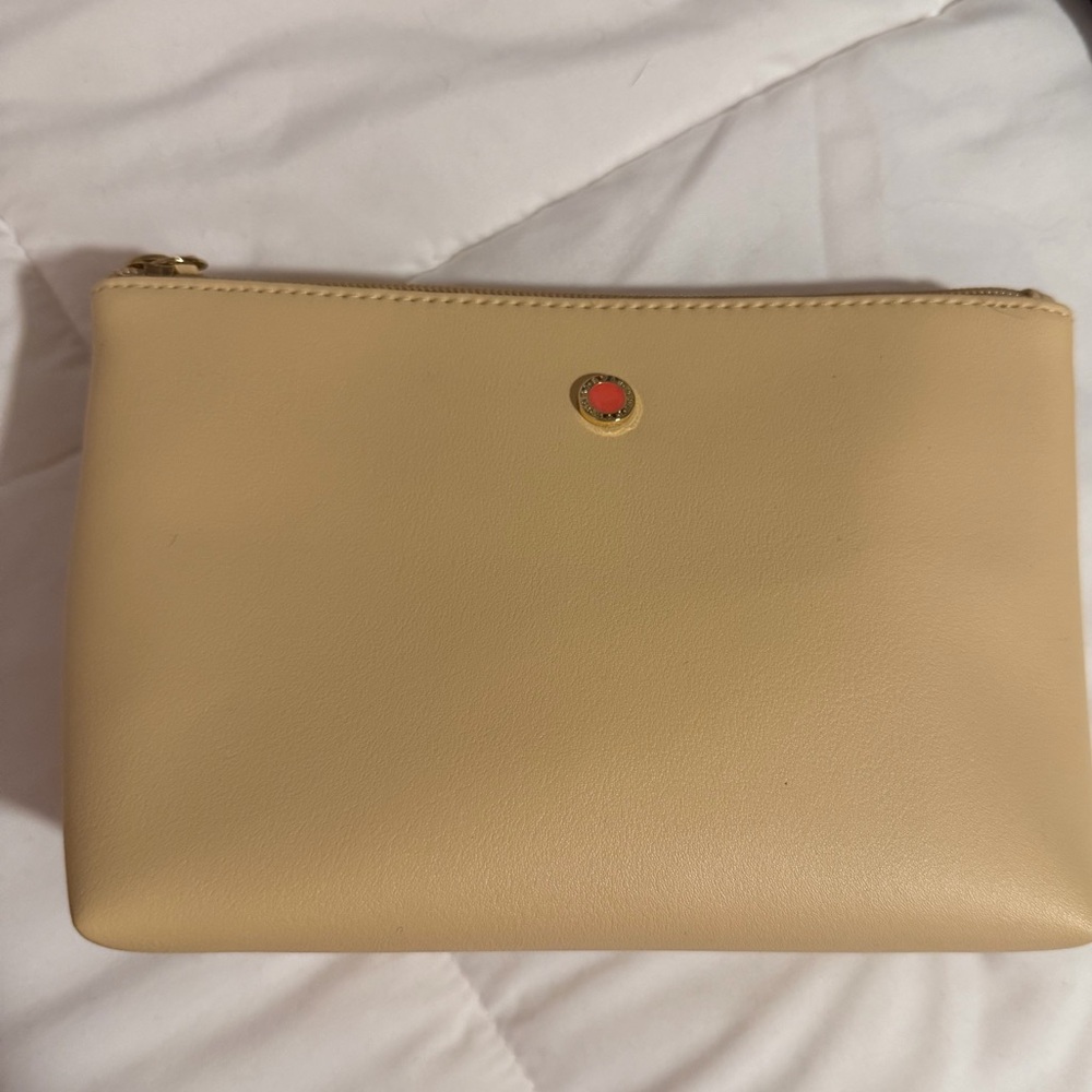Bvlgari Emirates tan amenity kit with beauty items as pictured!